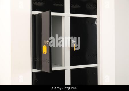 Modern lockers with bright keys indoors, closeup Stock Photo