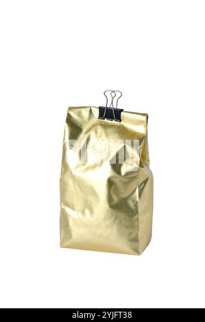 Gold foil coffee bean bag isolated on white background. Stock Photo