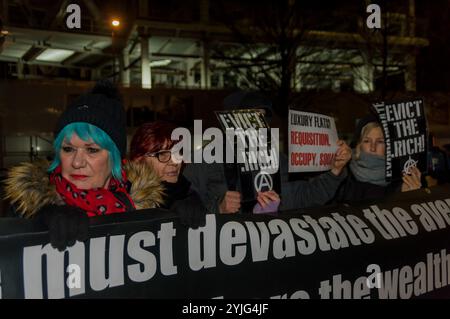London, UK. 8th February 2018. Class War protest outside The Shard this evening after defeating the attempt by lawyers representing the Qatari Royal Family who own the building to take out an injunction to prevent their protest. The protest was at the Shard as there are said to be ten £50 million pound apartments there which have remained empty since the building was completed at a time when London has a huge housing crisis with so many homeless and sleeping on the street. Class War aim to highlight the huge number of empty properties in London where there are so many large development of high Stock Photo