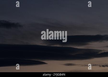 Dark clouds at dusk with venus shinning in the top centre. Kanagawa, Japan. Stock Photo