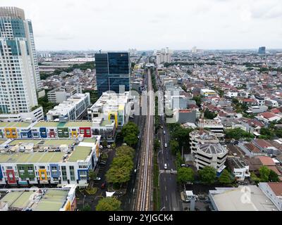 Aerial view of modern and colorful architecture in Jakarta city center, urban layout of Indonesia capital, blend of residential and commercial buildin Stock Photo