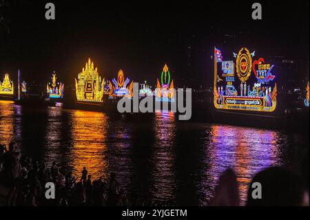 a parade of Illuminated floats cast their reflection on the Tonle Sap River during The Cambodian Water Festival. Phnom Penh, Cambodia. © Kraig Lieb Stock Photo