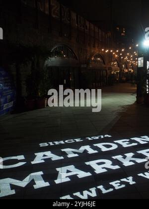 Lights on the ground advertising Camden market at night in London, United Kingdom Stock Photo