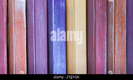 closeup of colorful vintage wooden top texture background.painted different colors in stripes Stock Photo