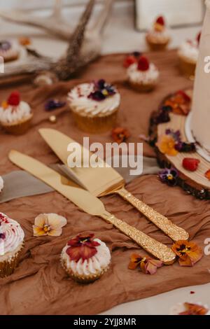 Wedding wildflower Golden cake cutter Stock Photo