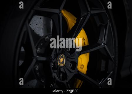 Close Up of Lamborghini Urus Performante Wheel with Yellow Caliper Stock Photo