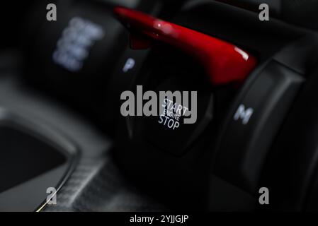 Close Up of Start or Stop Engine Button in Luxury Supercar Interior Stock Photo