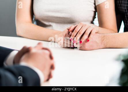 Family counseling. Couple in psychotherapy, therapy session. Meeting with marriage counselor, psychiatrist, psychologist or therapist. Stock Photo