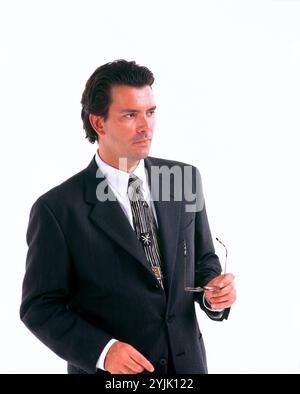 Business & Professions. Young executive man in suit. Close-up. Stock Photo