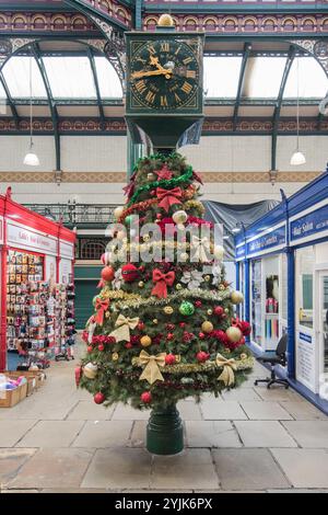 The Marks & Spencer's heritage is marked by the Market Clock in the 1904 hall which bears the shop's name. Stock Photo