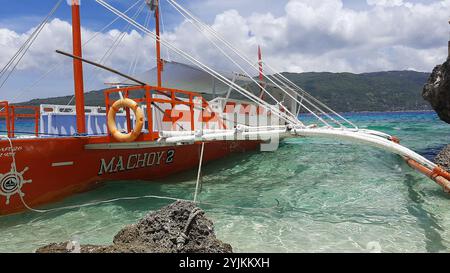 A tourist boat moored at Sumilon Island off the coast of Oslob on Cebu island in the Philippines Stock Photo