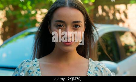 Happy excited amazed Caucasian woman female girl student client buyer buy new car automobile showing driver license successfully passed exam test Stock Photo