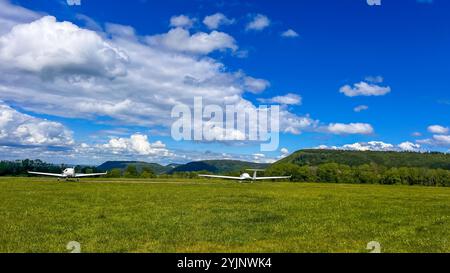 2 modern aircraft stand on an open area. Good weather for a plane flight. High quality photo Stock Photo