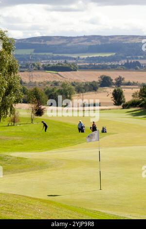 people playing golf on Strathmore Golf Course near  Alyth, Perth and Kinross, Scotland Stock Photo