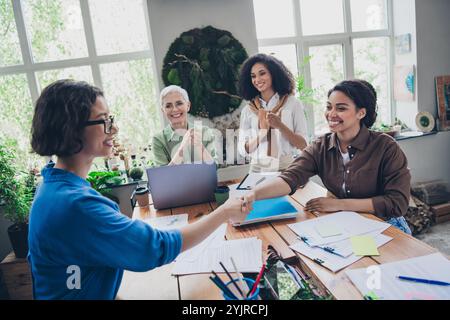 Photo of successful corporate women applaud handshake modern interior office business center indoors Stock Photo