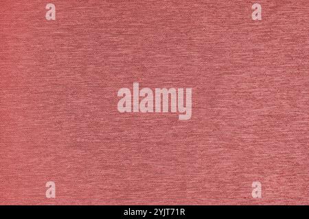 Closeup, macro of red fabric texture background. Satin weaving cloth structure, canvas. Textile for decor, upholstery, garment. Wallpaper, backdrop. Stock Photo