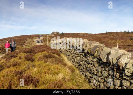 Walkers on the path to the Jubillee Tower, Moel Famau, in the Clwydian Range, North Wales Stock Photo