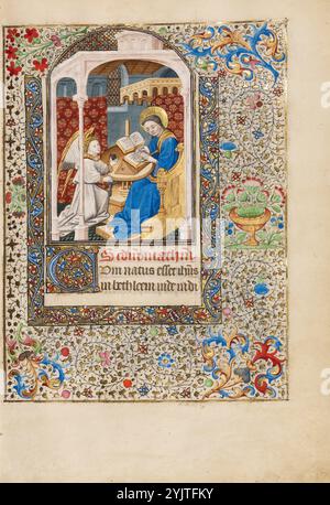 Saint Matthew; Book of Hours, about 1440-1450. An angel holds Matthew's inkwell as he writes his gospel. Stock Photo