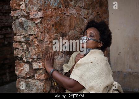 Black woman chained and with an iron mask on her mouth, representing the slave Anastacia. Slavery in Brazil. Feeling of pain. Stock Photo