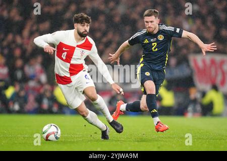 Croatia's Josko Gvardiol (left) and Scotland's Anthony Ralston battle for the ball during the UEFA Nations League Group A1 match at Hampden Park, Glasgow. Picture date: Friday November 15, 2024. Stock Photo