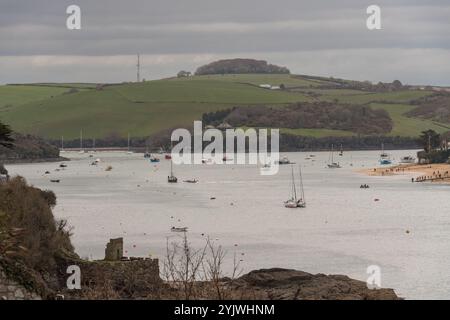 View along Salcombe Estuary from above beaches to the south, showing ferry queue at East Portlemouth, Scoble Point, Westerncombe - spring day. Stock Photo