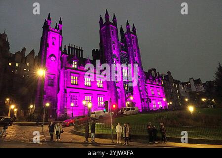 Edinburgh, Scotland, UK. 14th November, 2024.  UK Weather:  Autumn weather anticyclonic gloom saw christmas arrive in edinburgh with the dazzling frontage of edinburgh university new college school of divinity on the mound with a myriad of colours and designs for the festivities,. Credit Gerard Ferry/Alamy Live News Stock Photo