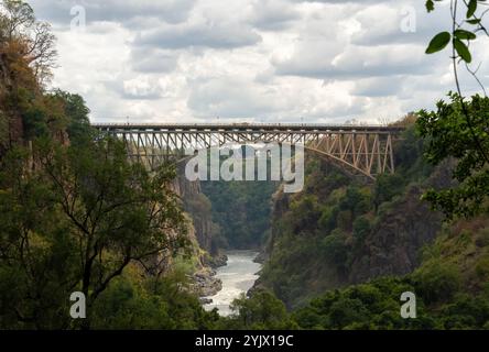 The Victoria Falls Bridge, designed by the Cleveland Bridge and Engineering Company, built between 1904 and 1905, with the Zambezi River flowing under Stock Photo