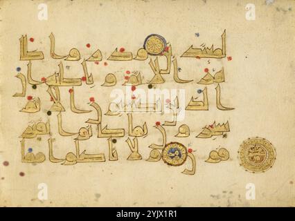 Decorated Text Page (Surat al-An&#x2018;am 6:119-121), 9th century.  Additional Info:The graceful, arabesque lines drawn here are Kufic script-an early, angular way of writing Arabic. The words, outlined in black and filled in with gold leaf, are read from right to left. Gold text was reserved for the earliest written portions of the Koran, which convey only the consonants of spoken Arabic and thus can be interpreted in various ways. The blue and red dots on the page indicate vowel sounds, while the accent marks distinguish consonants of the same basic form. These additions ensure a single int Stock Photo