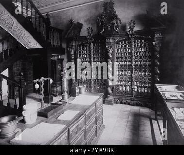 An eighteenth-century apothecary's shop with intricately carved wooden showcases; recreated for the Deutsches Museum in Nürnberg. Stock Photo