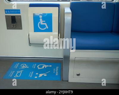 One corner inside the train where you can put a folding bicycle, baby carriage or wheelchair for disabled people Stock Photo
