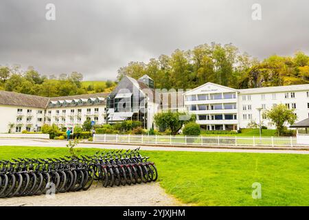 Hotel Fretheim is a 4 star hotel in the village of Flam, pictured with bicycle hire rental shop in the village,Norway,Europe Stock Photo