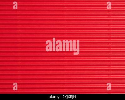 Red cardboard or paper texture using as holiday background or header Stock Photo
