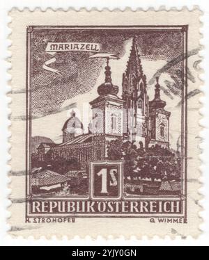 AUSTRIA - 1959 January 19: 1 shilling chocolate postage stamp depicting Basilica of Mariazell. Mariazell, city in the southeastern state of Styria, well known for being a hub of winter sports and a pilgrimage destination, it is located 143 kilometres (89 miles) north of Graz. It is picturesquely situated in the valley of the Salza, amid the north Styrian Alps Stock Photo