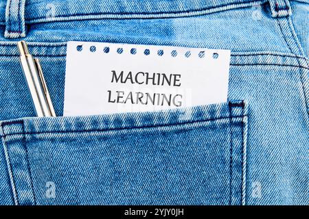 The concept of technology and development. Phrase, words, text MACHINE LEARNING API It's written on a piece of paper in my jeans pocket. Stock Photo