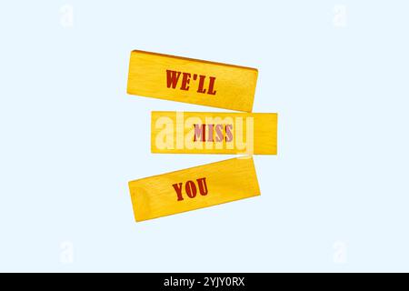 Business concept. Conceptual phrase, words, text WE WILL MISS YOU written on wooden bars, top view. Stock Photo