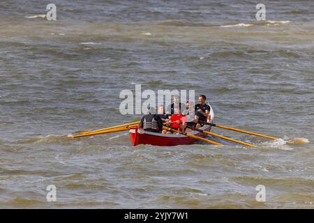 Pilot gig racing off Clevedon beach Stock Photo - Alamy