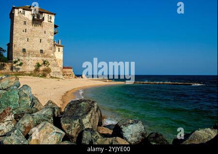 An old tower on the sea shore in the town of Ouranoupolis (Greece), called the Gate of Mount Athos Stock Photo