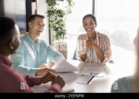 Happy young diverse business colleagues meeting for teamwork Stock Photo