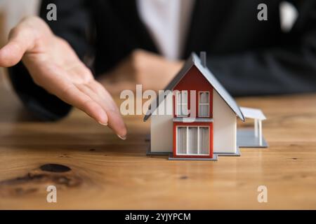 Female real estate agent offering new build property Stock Photo