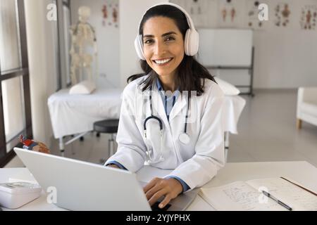 Portrait of professional medical worker sitting at workplace Stock Photo