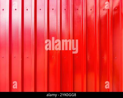Metal sheet background texture. Corrugated panel red color painted closeup view Stock Photo