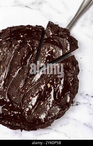 Chocolate cake, round cake, on a marble light table, top view, homemade cakes, no people Stock Photo