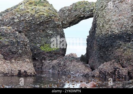 eroded arch at cushendun caves game of thrones filming location cushendun, county antrim, northern ireland Stock Photo
