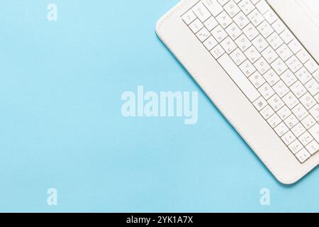 White Laptop Keybord on Blue background, Top view laptop background. Copy space for Text Stock Photo