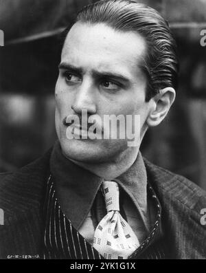 A Portrait of ROBERT DE NIRO as Vito Corleone in THE GODFATHER PART II 1974 Director FRANCIS FORD COPPOLA Novel MARIO PUZO Screenplay MARIO PUZO and FRANCIS FORD COPPOLA Music NINO ROTA Costume Design THEADORA VAN RUNKLE Paramount Pictures / The Coppola Company / American Zoetrope Stock Photo