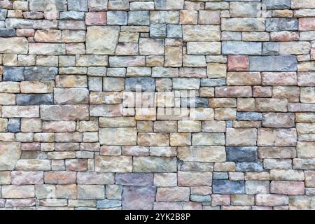 Vibrant Multicolored Brick Wall with Artistic Patterns Stock Photo
