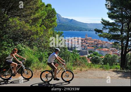 couple of cyclists in Korcula old town heights, Korcula island, Croatia, Southeast Europe Stock Photo
