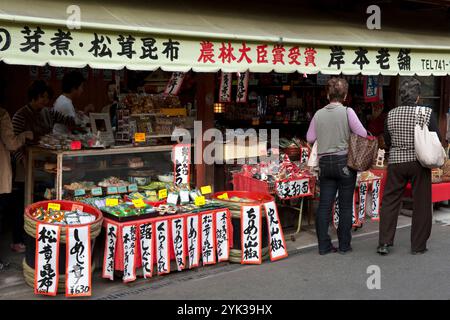 Customers at a small town general store selling a variety of groceries and foodstuffs in the village of Kurama, Kyoto, Japan. Stock Photo