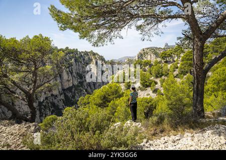 Woman standing on the limestone cliffs in the Calanques National Park between Cassis and Marseille, Provence, France, Europe Stock Photo