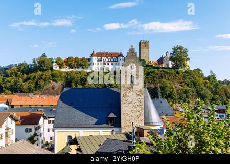 View from the Haschlberg viewpoint of the parish church of the Immaculate Conception and Neubeuern Castle in Chiemgau in Upper Bavaria in Germany Stock Photo